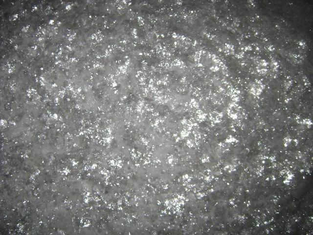 C-28 bulk sample — coarse glass flake showing characteristic light-grey colour and flat lamellar form